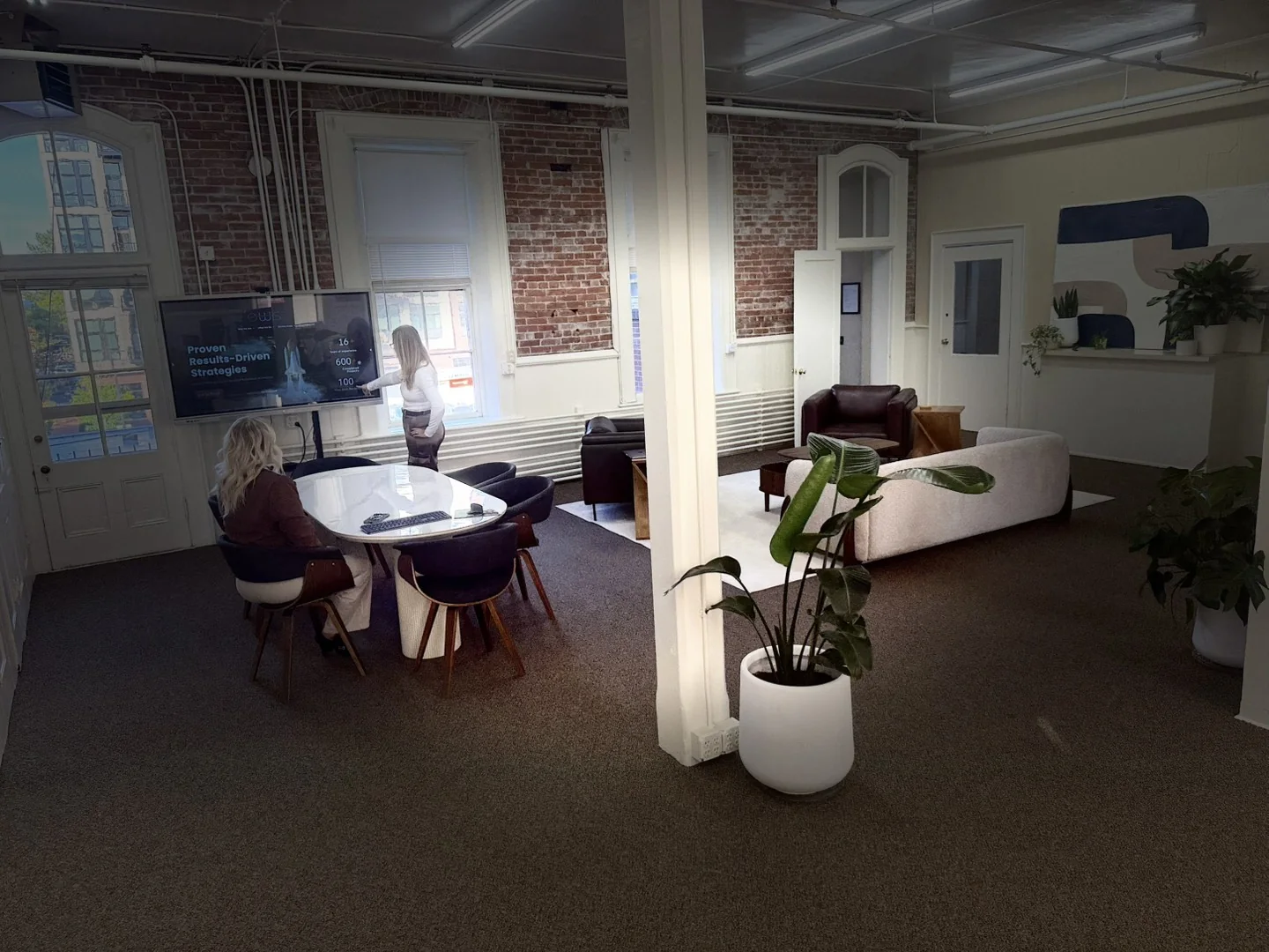 The Effective Web Solutions team reviewing a marketing strategy in the EWS office